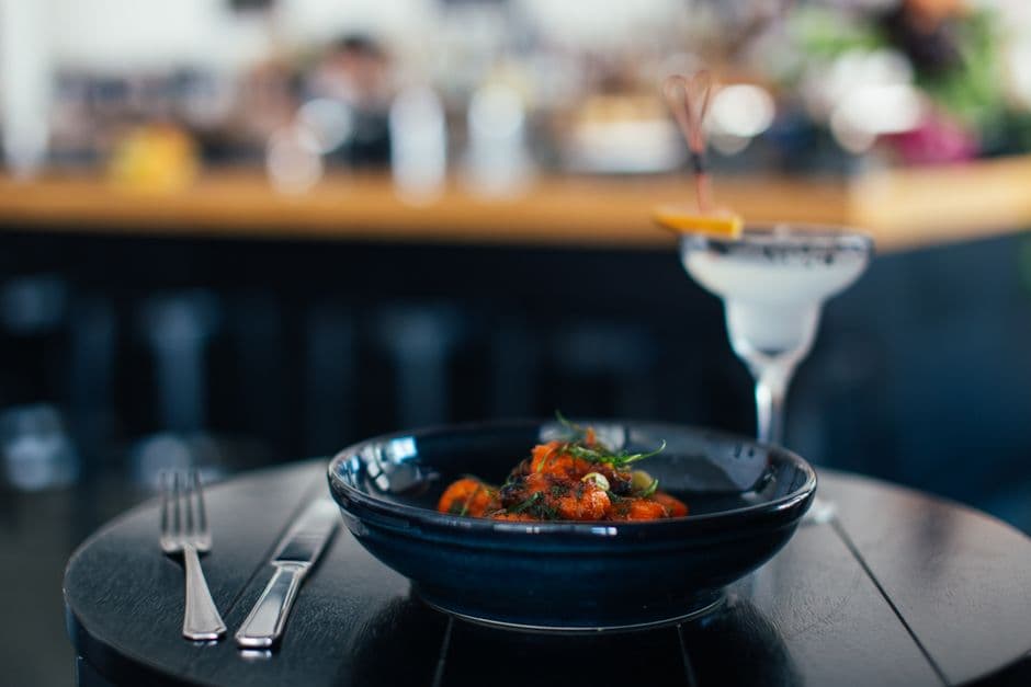 A plated restaurant dinner on a table, estimated with a calorie scanner because it carries no nutrition label