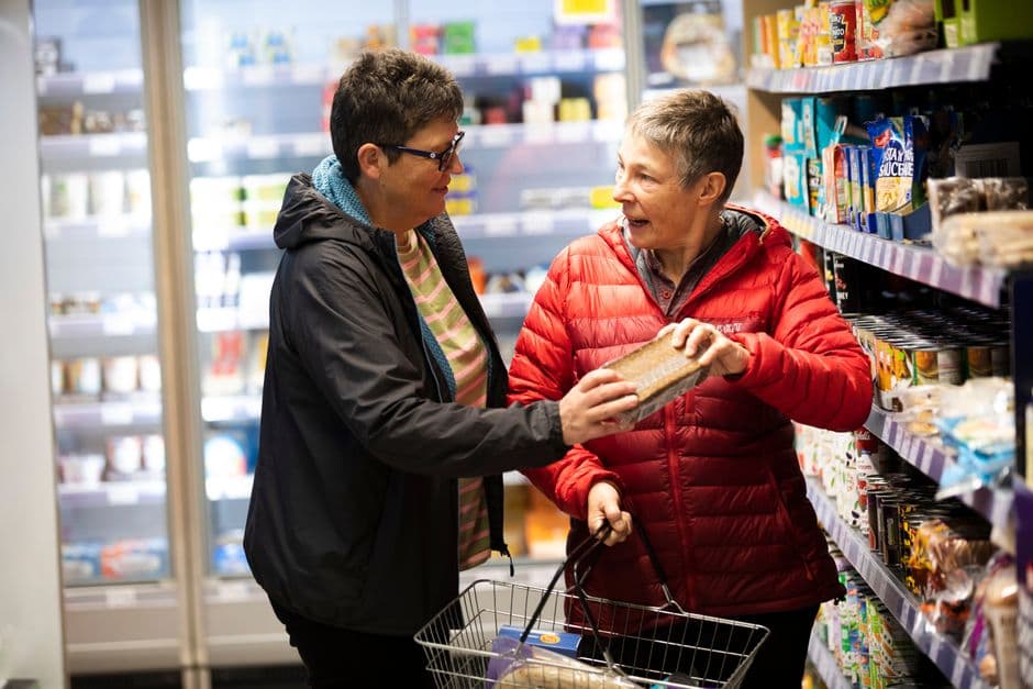 Packaged grocery products in a shopping basket, the three million barcoded foods a calorie scanner app can look up